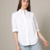 A classic Tommy Hilfiger Oxford shirt in crisp white with a button-down design and an embroidered logo on the chest for timeless elegance.